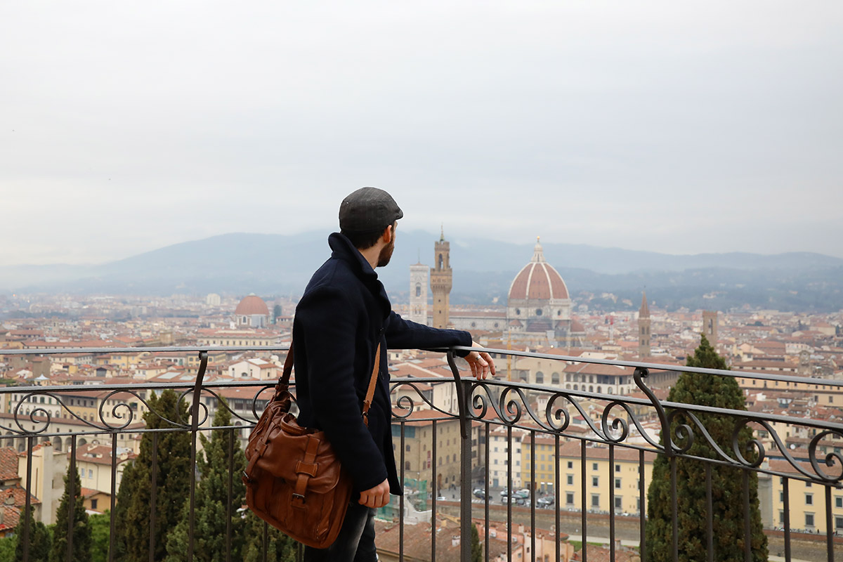 Man overlooking Florence skyline – travel portrait photography.
