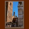 Fine art framed print of historic brick architecture with green copper spires and stone facades against a blue sky, L'Apertura by Scott Allen Wilson, available in 8x12 and 16x24.