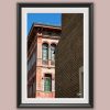Fine art framed print of an ornate Italian facade with arched windows and green shutters against a blue sky, Just Wait by Scott Allen Wilson, available in 8x12 and 16x24.
