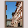 Fine art framed print of an ornate Italian street facade with arched windows and terracotta details against a blue sky, LRC by Scott Allen Wilson, available in 8x12 and 16x24.