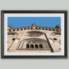 Fine art framed print of an ornate Romanesque facade with a rose window and intricate stone carvings against a blue sky, Looking to the East by Scott Allen Wilson, available in 8x12 and 16x24.