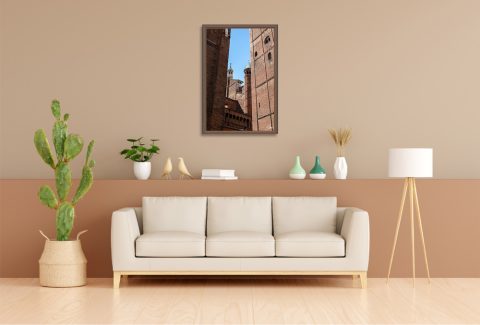 Supercut by Scott Allen Wilson framed travel print displayed on a living room wall above a cream sofa.