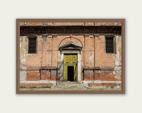 Fine art framed print of a weathered historic brick facade with a striking yellow green arched doorway, The Door Is Always Greener by Scott Allen Wilson, available in 8x12 and 16x24.