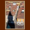 Fine art framed print of a dramatic aerial view of terracotta rooftops and a narrow Italian street with a bold architectural shadow, The Inevitable by Scott Allen Wilson, available in 8x12 and 16x24.