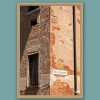 Fine art framed print of a weathered Italian street corner with peeling plaster, exposed brick and a vintage street sign, Vai Via Colletta by Scott Allen Wilson, available in 8x12 and 16x24.