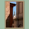 Fine art framed print of a narrow gap between historic brick and stone buildings with a green spired turret in the distance, La Chiusura by Scott Allen Wilson, available in 8x12 and 16x24.