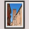 Fine art framed print of a crenellated brick structure rising above a narrow Italian street flanked by historic buildings, Lost in Patience by Scott Allen Wilson, available in 8x12 and 16x24.