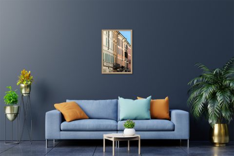 Minimalist framed travel photograph of warm-toned facades and shutters in historic Pavia.