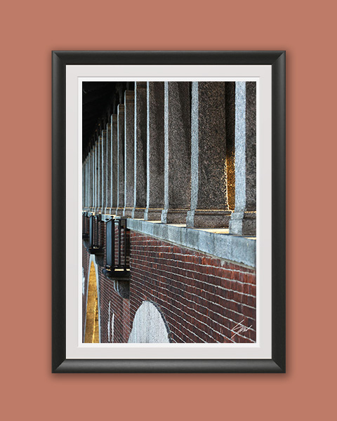 Fine art travel photograph capturing symmetry, depth, and texture along a covered walkway in Pavia.
