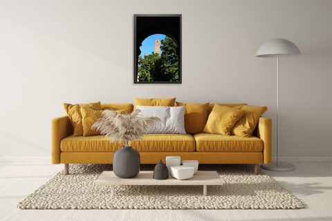 Travel photography print of Pavia with vibrant greenery, blue sky, and historic brick architecture.