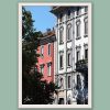Framed travel art print of elegant architecture and colorful facades in historic Pavia, Italy.