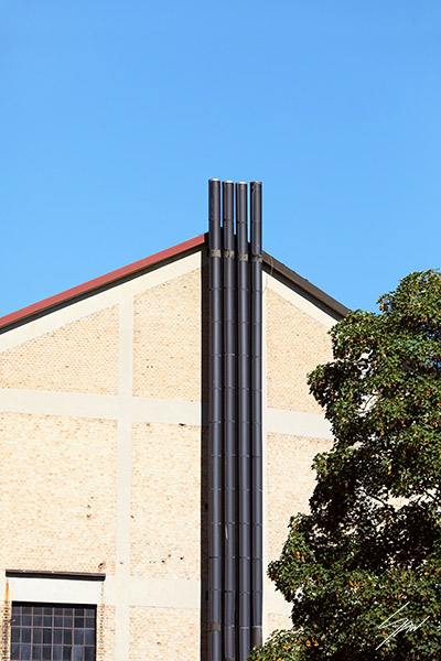 Fine art travel photograph featuring clean lines, blue skies, and modern architectural detail.