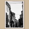Framed B&W travel print featuring balconies, shadows, and urban textures in historic Italy.