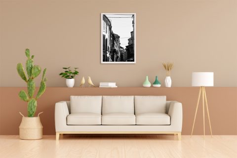 Framed B&W travel print featuring balconies, shadows, and urban textures in historic Italy.