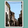 Travel framed art displayed in a modern living room interior with minimalist decor.