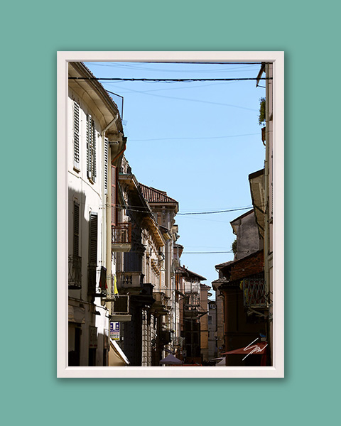 Travel framed art displayed in a modern living room interior with minimalist decor.