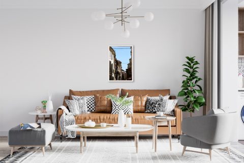 Travel framed art displayed in a modern living room interior with minimalist decor.
