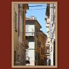 Fine art travel photograph capturing layered architecture, balconies, and overhead power lines in Pavia.