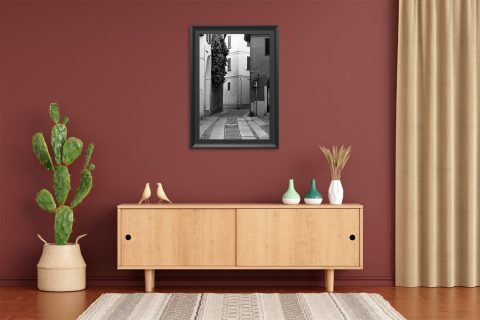 Framed black and white travel print featuring winding architecture and minimalist urban detail.