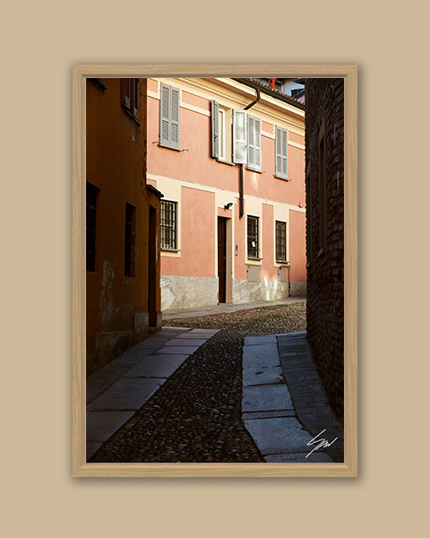 Fine art travel photograph capturing soft light, shadows, and quiet streets in Pavia.