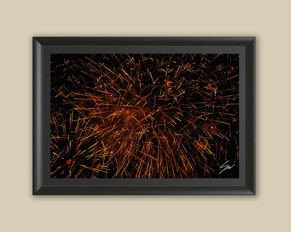 Framed fine art print featuring golden fireworks lighting up the night sky over Recco, Italy.