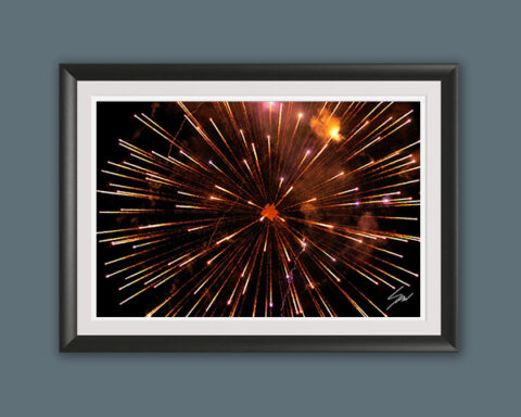 Color fine art photograph of golden fireworks exploding over Recco, Italy, creating a dramatic starburst against the night sky.