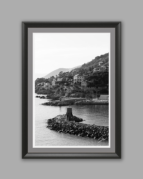 Fine art photography wall print featuring a monochrome view of the Ligurian coastline with its historic breakwater, harbor, and Mediterranean village. wall art travel print wall art travel print