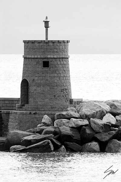 Coastal fine art print featuring a lighthouse on the Italian Riviera in monochrome, celebrating maritime architecture and minimalist seaside landscapes.