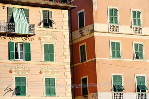 Framed wall art capturing the architectural details of historic buildings in the Italian Riviera.