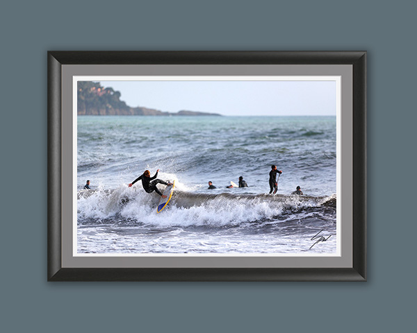 Surf photography wall art featuring a surfer mid-turn on a breaking wave, bringing the energy of the Mediterranean coast into your home. Fine art print