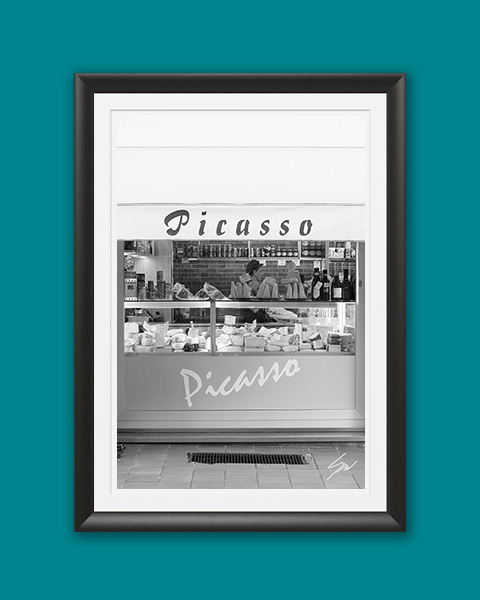 Monochrome travel photography print featuring the historic Picasso storefront, bringing authentic Italian charm and minimalist style to any interior.