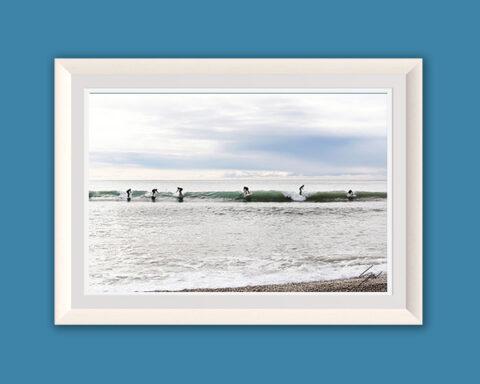 Party Wave fine art print captures surfers sharing a wave in Recco, Italy. Coastal photography inspired by surf culture and life on the Ligurian Sea.