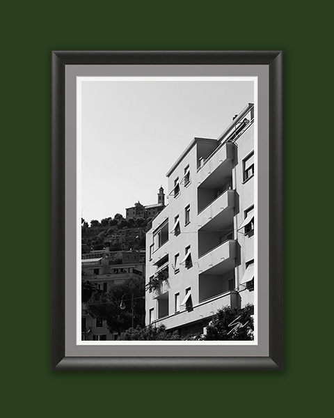 Monochrome architectural wall art capturing the dialogue between contemporary buildings and historic Italy in a timeless travel photograph.