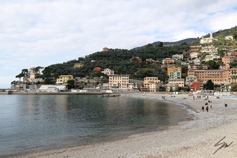 Panoramic fine art photograph of Recco's beach and hillside on a calm winter day along the Italian Riviera.