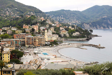 Framed panoramic photography print of Recco, Italy, with sweeping views of the seaside town, harbor, and surrounding hills.