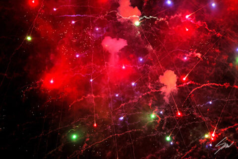 Travel fine art wall print featuring an abstract display of red fireworks, glowing sparks, and dramatic light against a dark night sky.