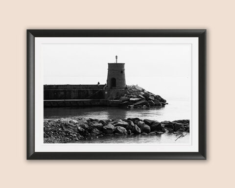 Black and white fine art photograph of Torretta, the historic lighthouse guarding the harbor on the Italian Riviera, bringing timeless coastal elegance to any space.