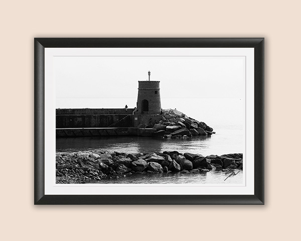 Black and white fine art photograph of Torretta, the historic lighthouse guarding the harbor on the Italian Riviera, bringing timeless coastal elegance to any space.